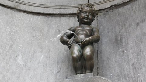 BRUSSELS, BELGIUM - SEPTEMBER 15, 2013: The iconic Manneken Pis statue near Grand Place in Brussels, Belgium