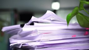 Businessman searching documents files or information in Stack of papers folder on work in office, Business report paper or piles of unfinished document achieves with clips on offices, Business concept