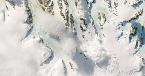 Very high-altitude overflight aerial of unusual, late-season melting across the Antarctic peninsula. Clip loops and is reversible. Elements of this image furnished by NASA