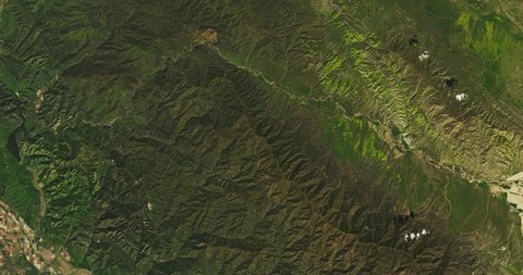Very high-altitude overflight aerial of San Luis Obispo and Santa Barbara Counties, California. Clip loops and is reversible. Elements of this image furnished by NASA