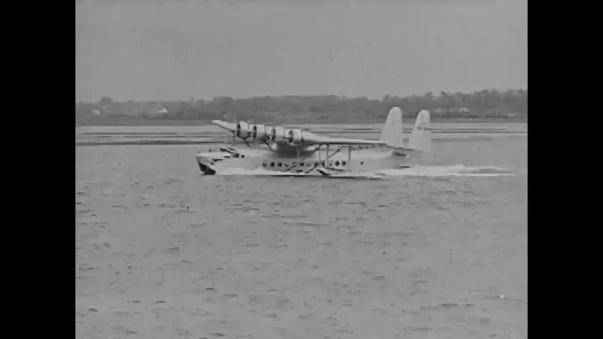 CIRCA 1930s - Ground crews launch a Sikorsky aircraft, a flying boat airliner, in waters?it takes off and lands in the 1930s.