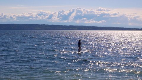 Camano Island State Park, Washington State. Nondescript, stand-up paddle boarder in the distance. 10 sec/24 fps. Version 4b