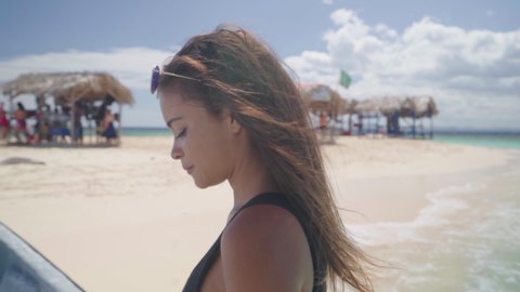 Slow Motion: Beautiful Young Woman Prepares to Exit Boat - Cayo Arena, Dominican Republic