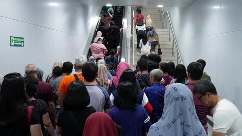 Jakarta, Indonesia - April 19, 2019: Jakarta MRT - Passenger Queued up for escalator