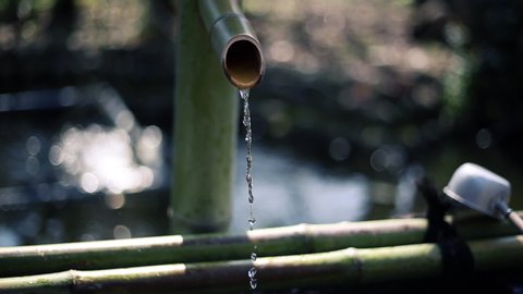 Dropping a pure water drop from a Japanese bamboo pipe (Shishi-odoshi) 