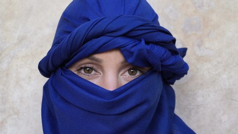 Portrait of woman wearing blue tuareg headscarf