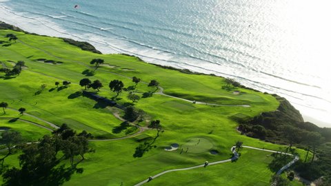 Aerial view of Torrey Pines coastal golf course green landscape set on cliffs along the Pacific shoreline California America RED WEAPON