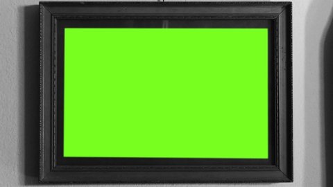 Old Wooden Frame with Green Screen. Black and White Tone. You can replace green screen with the footage or picture you want with “Keying” effect in  (check out tutorials on Internet). Zoom In.