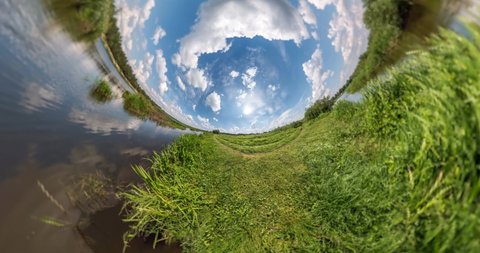 NO VR. Curvature of space of little planet transformation. Abstract torsion and spinning of full flyby panorama landscape near river in sunny day with awesome clouds.