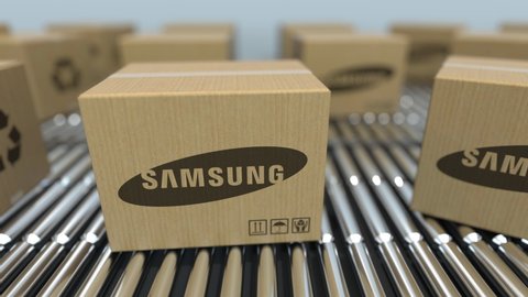 Carton boxes with SAMSUNG logo move on roller conveyor. Editorial loopable 3D animation