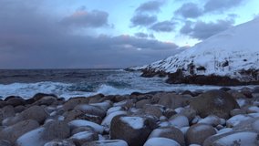 February cloudy evening on the shore of the Arctic ocean. Murmansk region, Russia