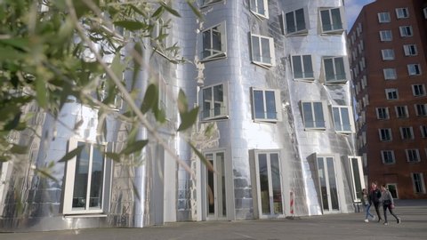 Dusseldorf, Germany - May 10, 2019: View of the Neuer Zollhof in Media Harbor, Dusseldorf, Germany. This building was designed by Frank O. Gehry and completed in 1998.