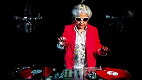 amazing DJ grandma, older lady djing and partying in a disco setting. these retired rockers will get the party going with overlayed abstract effects
