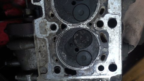 Old engine block of car in a workshop