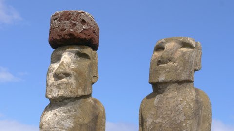 CLOSE UP Detailed shot of mysterious monolithic structures shaped as humans. Spectacular shot of world famous moais in Rapa Nui on a sunny summer day. Legendary archaeological finding on Easter Island