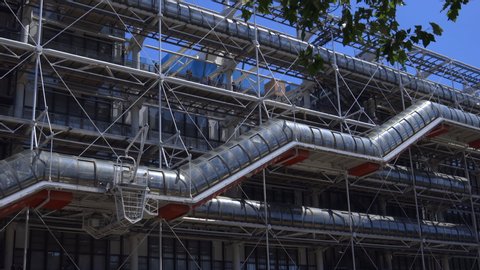 Paris, France - June 2019 :  Escalator of the Centre Pompidou Beaubourg in the center of Paris France, facade of the modern art and contempary museum with its famous escalator
