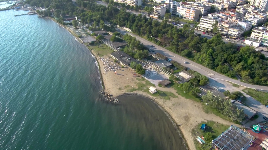 Aerial view of urban coast with leisure facilities in Thessaloniki Kalamaria Greece, move forward by drone