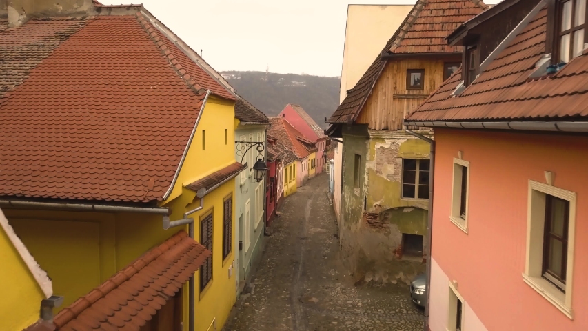 Beautiful view of a stone lane of the famous Sighisoara medieval town in cloudy day. Transylvania Romania. Aerial view travelling