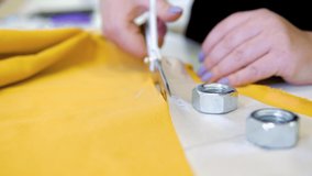Hands notch tailor tailor's scissors cloth cutting a piece of fabric (fashion designer concept)