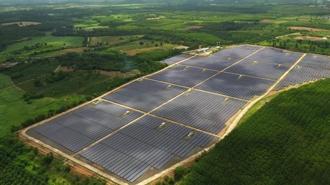 Aerial view ,Solar power plants have clouds moving through and sunlight shines.