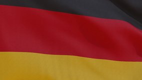 This stock motion graphics video shows a beautiful animation of the national flag of Federal Republic of Germany with highly detailed fabric texture, waving in slow motion. 4K seamless loop.
