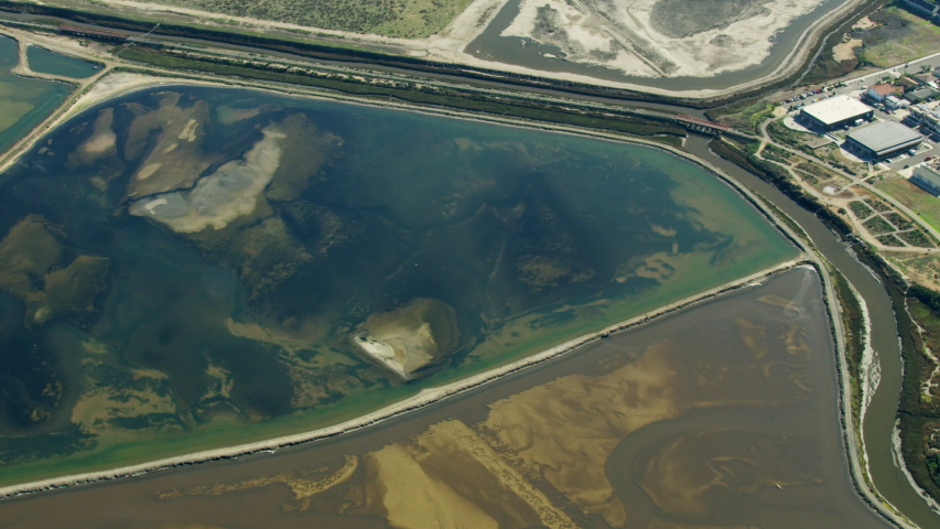 Aerial view of San Diego South Bay Salt works chemical salinity Ponds which form part of the National Wildlife Refuge Pacific ocean California USA RED WEAPON