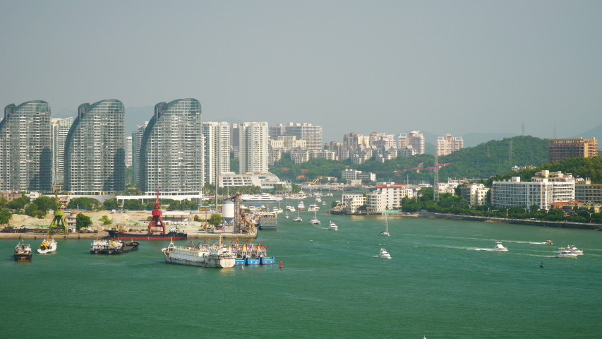 sanya city bay apartment block water traffic rooftop panorama 4k hainan china