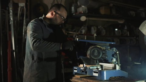 Employee Works With Professional Electric Tool For Sawing Wood.