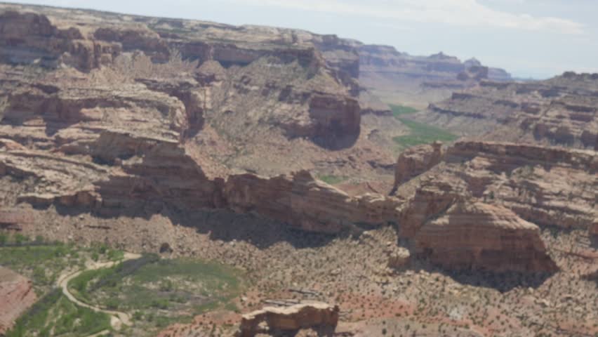 An amazing jib shot of a desert canyon in Southern Utah in the San Rafael Swell sometimes know as the Little Grand Canyon.  The San Rafael river runs through the canyon.