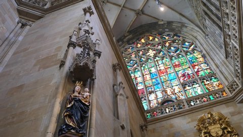 Czech Republic, Prague - April 30, 2019: Interior of St. Vitus Cathedral With Stained-Glass Window And Sculptures.