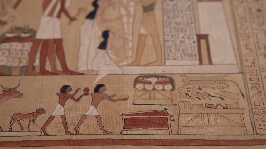 Opening of the Mouth Ceremony, GI of an ancient Egyptian papyrus paper, tilt up shot, shallow depth of field.