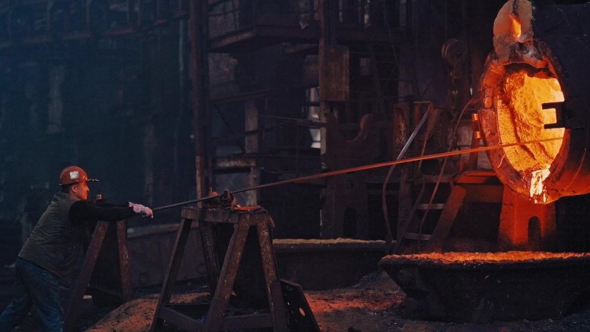 Hard work in a foundry. Metal smelting furnace in steel mill. Molten metal pouring, metallurgy, steel casting foundry. Steel manufacturing Royalty-Free Stock Footage #1031862809