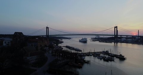 Gothenburg - Sweden. Circa April,2019: Stena Line ferry at the river passing under the suspension bridge and surrounding buildings.  