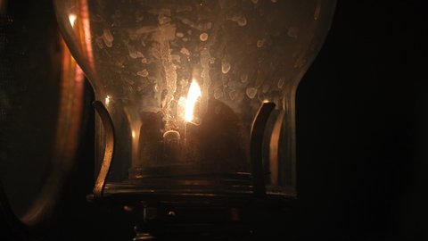 Old kerosene lamp flame dim in the night