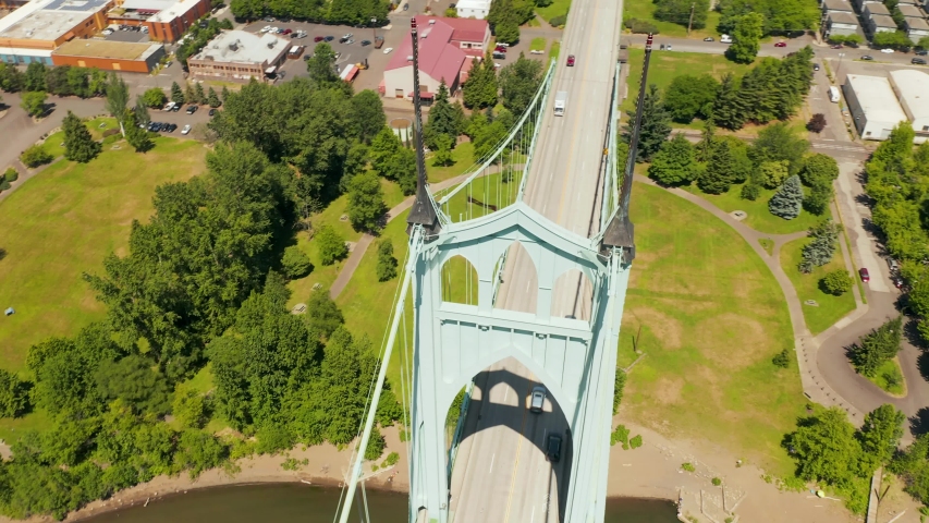 The St. Johns Bridge is a steel suspension bridge that spans the Willamette River in Portland, Oregon, United States, between the Cathedral Park neighborhood in North Portland and the Linnton 