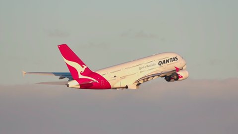 Sydney, Australia - May 31, 2019: Qantas Airbus A380 large passenger airliner taking off from Sydney airport at sunset.