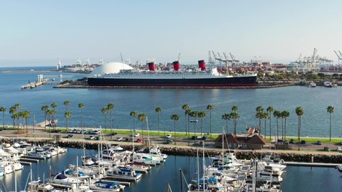 Aerial view of the queen Mary ship docked in the Long Beach harbor in California on a sunny day.