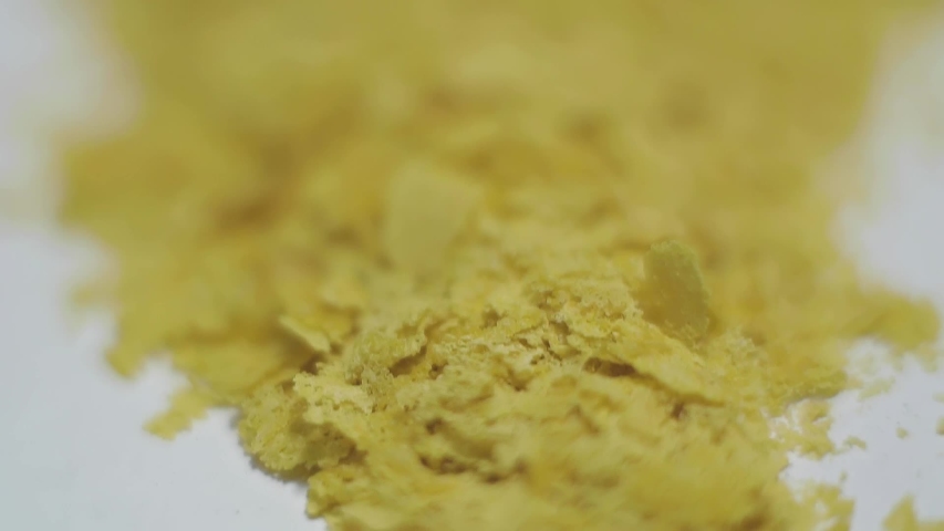 Nutritional Yeast macro vegan delicious golden flakes Royalty-Free Stock Footage #1031951078