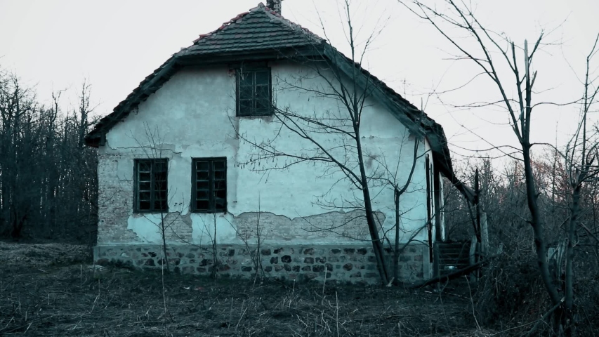 Old abandoned house in the mountain in the evening