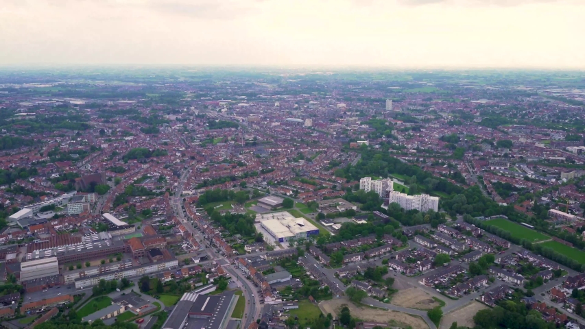 Slow moving aerial view of Kortrijk from a hot air balloon