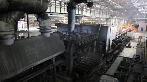Rolled steel in a steel mill. Steel production. Mechanized steel production.