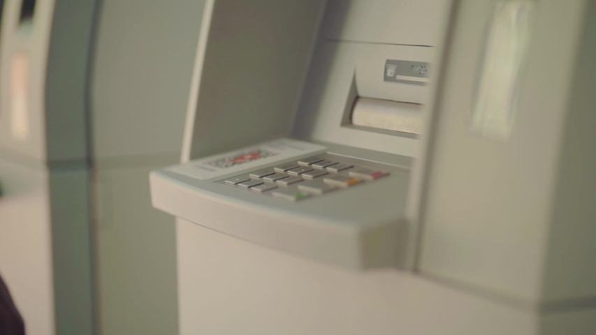 Close up of Afro-American businessman entering his pin code on keyboard of ATM, banking service, finance and people concept. Transfer, cash withdrawal. Soft selective focus Royalty-Free Stock Footage #1031980100