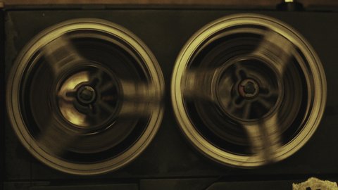 Close up of vintage tape recorder playing.