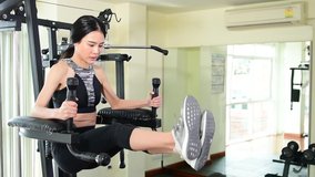 Video Asian beautiful sport woman workout for six pack arm muscle training in gym on morning sunshine, concept healthy and focus with success target