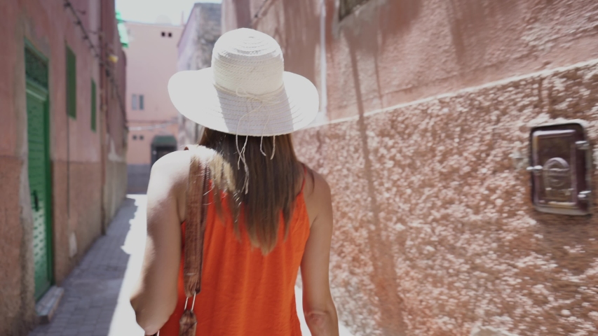 Beautiful woman walking through streets in Marrakech