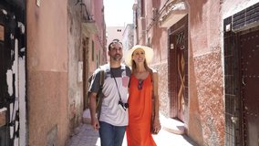 Couple walking through streets in Marrakech