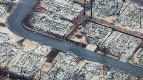 Aerial view of destructive forest wildfire which has laid waste to an entire town a community destroyed property and lives lost Paradise California RED WEAPON