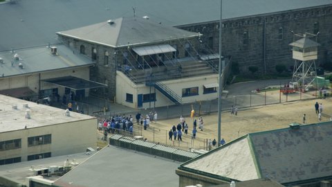 Aerial view of Folsom State Prison detention center inmates incarcerated enjoying some recreational exercise outdoors Northern California USA RED WEAPON
