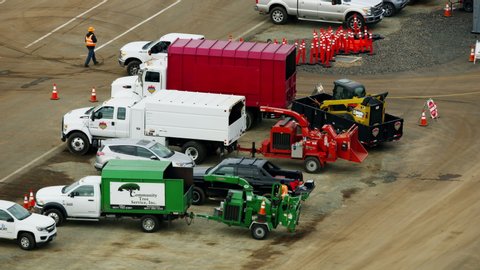 California USA - February 2019: Aerial view of Utility vehicles at local Paradise airport FEMA emergency depot after destructive wildfire RED WEAPON