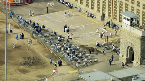 California USA - February 2019: Aerial view of Folsom State Prison detention center jailed inmates incarcerated in cells enjoying some recreational exercise outdoors RED WEAPON